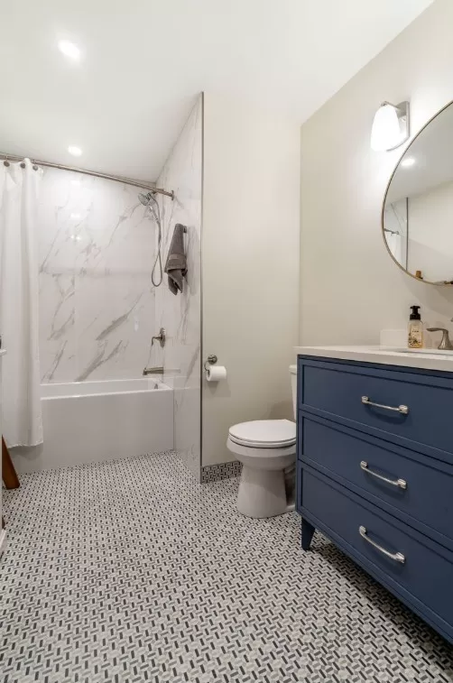 Gorgeous Bathroom with deco-inspired floor tile